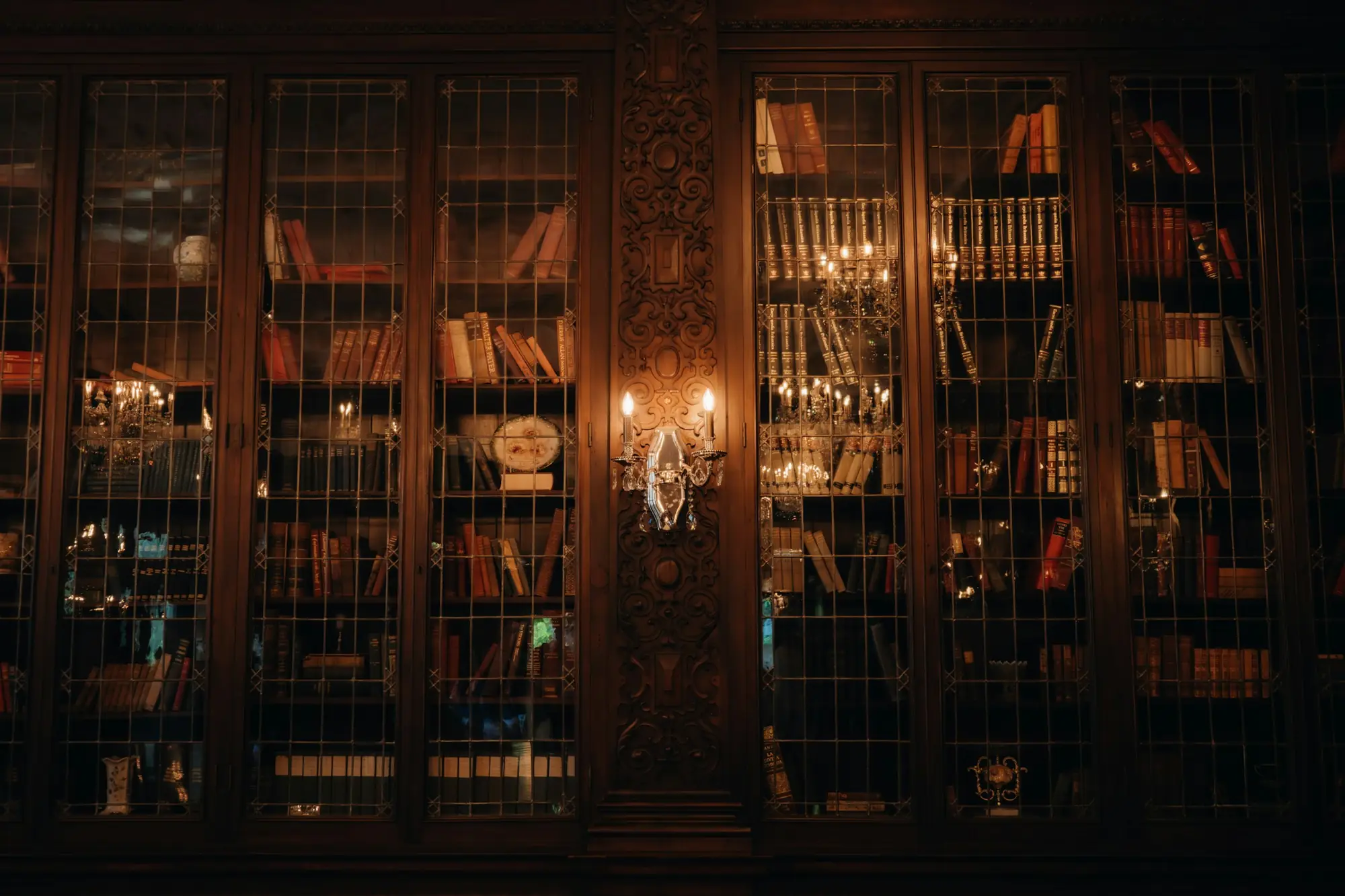 A quiet, lamp-lit library